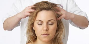 a woman receiving indian head massage